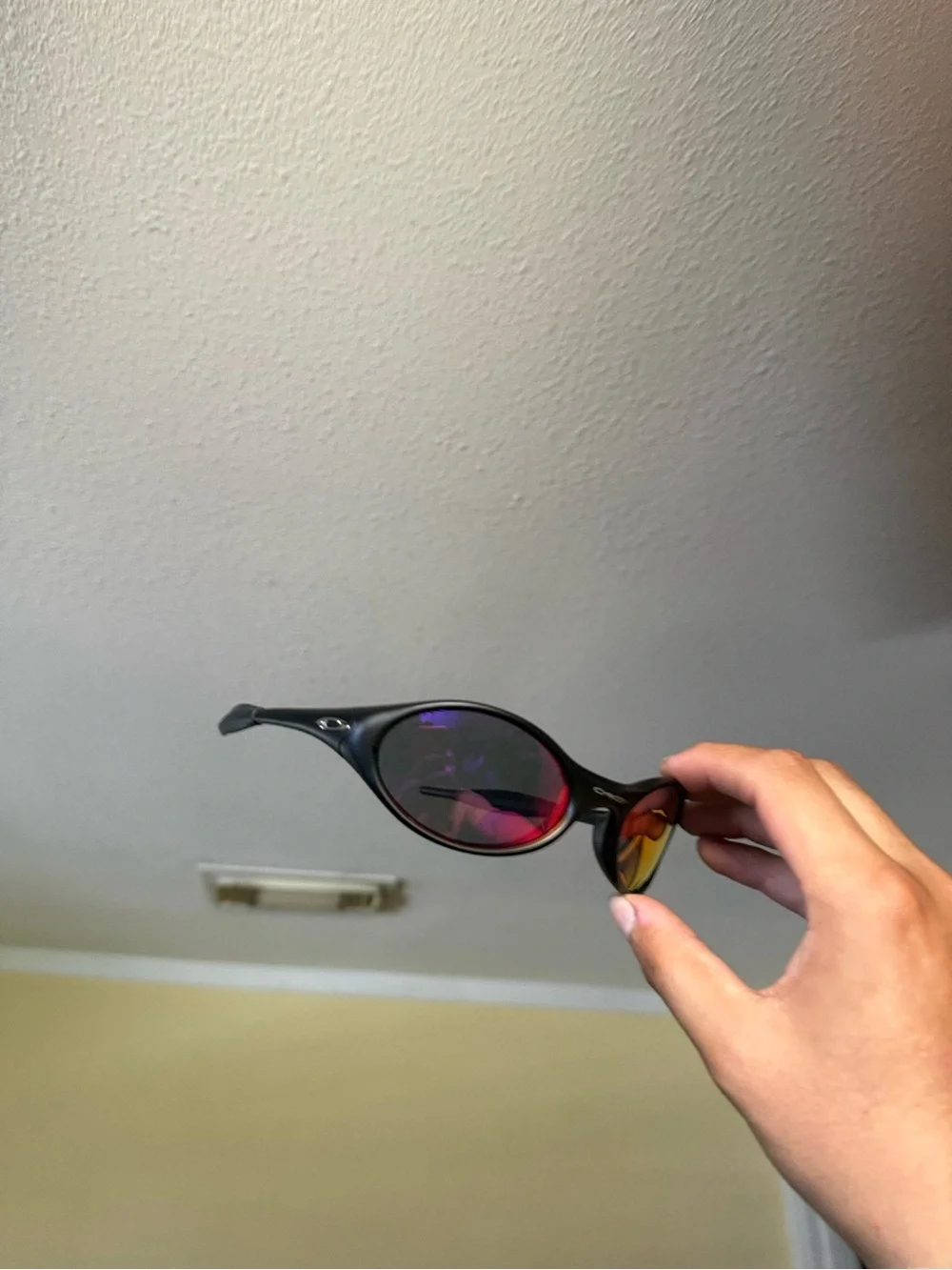 Black Sunglasses with Mirrored Red-Orange Lenses oakley